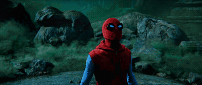 A Green Light Is Shining On A Person In A Dark Room GIF