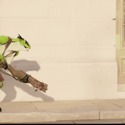 A Green Lizard Is Holding A Gun In Its Hand GIF