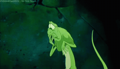 A Green Lizard Is Standing In The Dark With Its Arms Outstretched And A Caption That Says Fydisneymisfits GIF