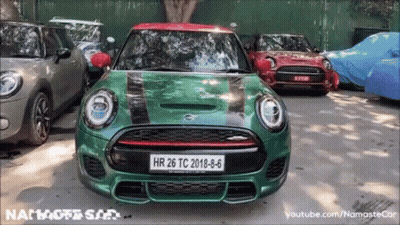A Green Mini Cooper With A License Plate That Says Hr 26 Tc 2018-8-6 GIF