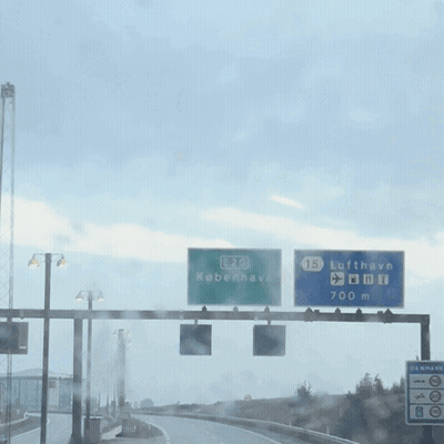 A Green Sign That Says E20 Kobenhavn GIF