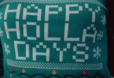 A Green Sweater That Says Happy Holla Days GIF