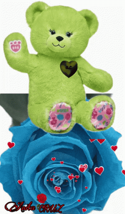 A Green Teddy Bear Sits On Top Of A Blue Rose With Hearts Around It GIF