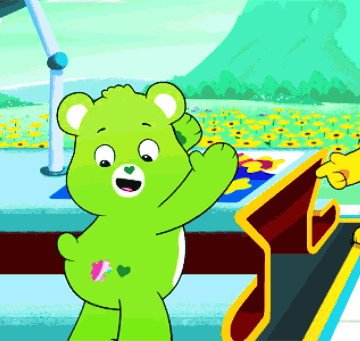 A Green Teddy Bear With A Pink Heart On Its Butt GIF