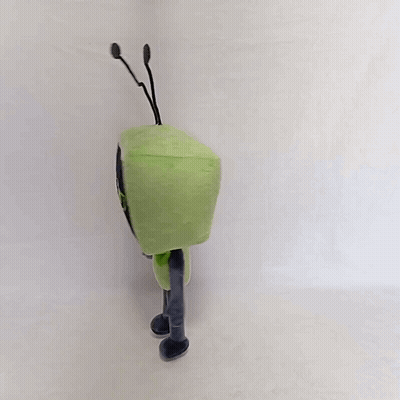 A Green Toy With Antennas On Its Head Is Standing On A White Surface GIF