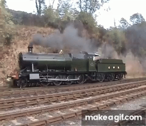 A Green Train With The Letter O On The Side GIF