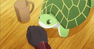 A Green Turtle Is Sitting On A Wooden Table Next To A Cup . GIF