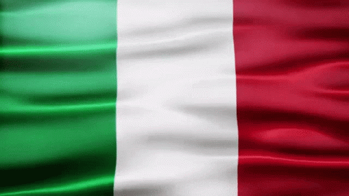 A Green White And Red Flag Is Flying In The Wind GIF