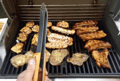 A Grill With A Lot Of Meat On It GIF