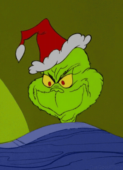 A Grinch Cartoon With A Santa Hat On His Head GIF