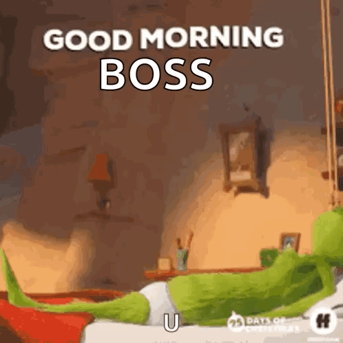 A Grinch Is Laying On A Bed With A Good Morning Boss Greeting . GIF