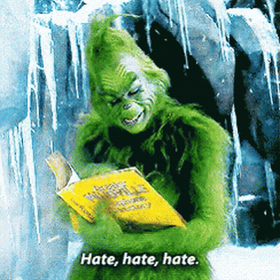 A Grinch Is Reading A Book With The Words Hate Hate Hate GIF