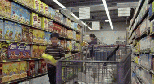 A Grocery Store Aisle With Boxes Of Potato Wheaten Oats GIF