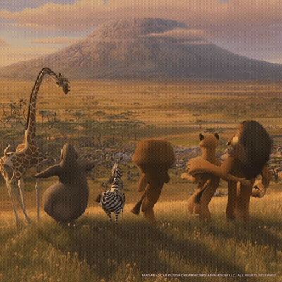 A Group Of Animals From The Movie Madagascar Are Standing In A Field With A Mountain In The Background GIF