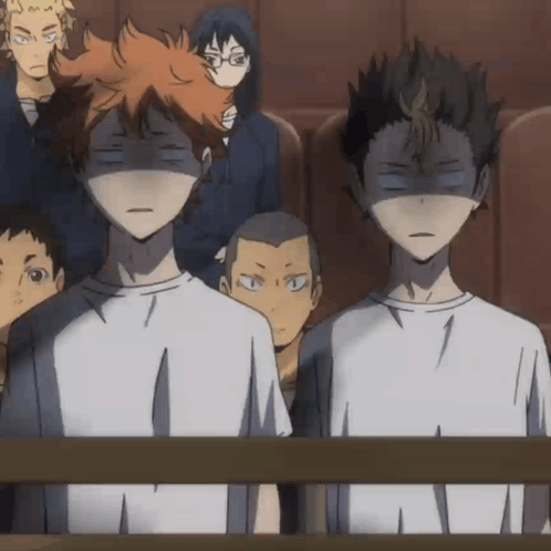 A Group Of Anime Characters Are Sitting In A Theatre With Their Eyes Closed . GIF