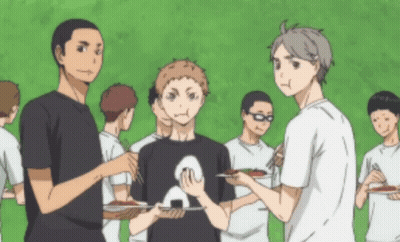 A Group Of Anime Characters Are Standing Around Eating GIF
