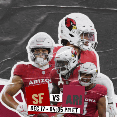 A Group Of Arizona Football Players Holding Up A Sign That Says Sf Vs Ari GIF