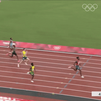A Group Of Athletes Are Running On A Track With Omega Written On The Side Of The Track GIF