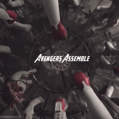 A Group Of Avengers Assemble In A Circle With Their Hands Together GIF