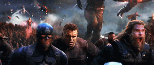 A Group Of Avengers Including Captain America Thor And Hulk Are Standing In Front Of A Crowd GIF