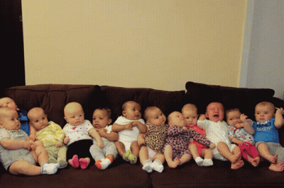 A Group Of Babies Are Sitting On A Couch And One Of Them Is Wearing A Shirt That Says Daddy GIF