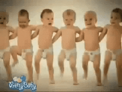 A Group Of Baby 'S In Diapers Are Dancing Together GIF