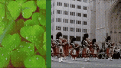 A Group Of Bagpipe Players Are Marching Down A City Street GIF