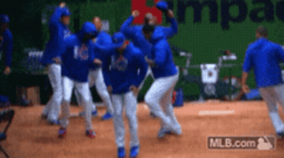 A Group Of Baseball Players Are Celebrating On The Field GIF