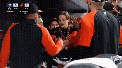 A Group Of Baseball Players Are Gathered In A Dugout With A Scoreboard That Says Uquidy GIF