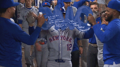 A Group Of Baseball Players Are Holding A Sign That Says Omg GIF
