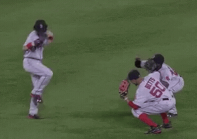 A Group Of Baseball Players Are Playing A Game On A Field . One Of The Players Has The Number 50 On His Jersey . GIF