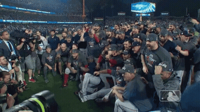 A Group Of Baseball Players Are Posing For A Photo With A Budweiser Sign In The Background GIF