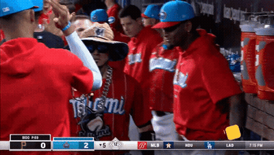 A Group Of Baseball Players Are Standing In A Dugout With A Scoreboard That Says Mlb At The Top GIF
