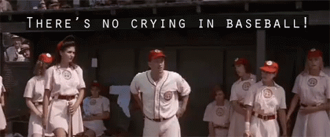 A Group Of Baseball Players Are Standing In A Dugout With The Words " There 'S No Crying In Baseball " Written Above The GIF