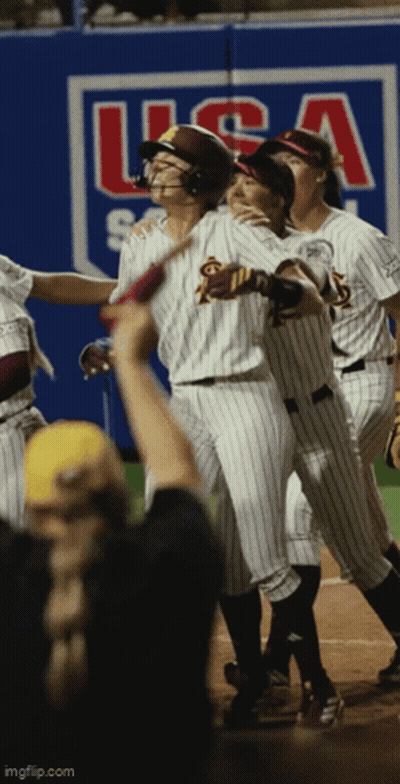 A Group Of Baseball Players Are Standing In Front Of A Wall That Says Usa GIF