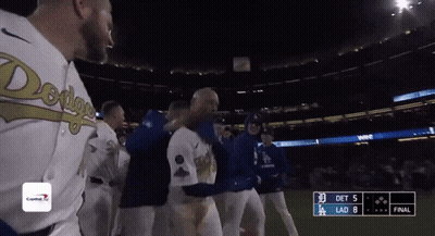 A Group Of Baseball Players Are Standing On A Field With A Scoreboard That Says Det 5 Lad 8 GIF