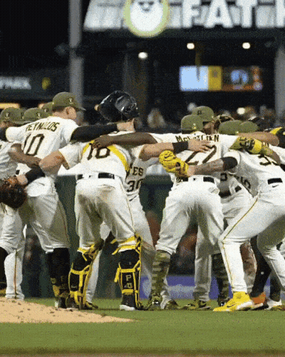 A Group Of Baseball Players Huddle Together With One Wearing The Number 30 GIF