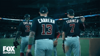 A Group Of Baseball Players Including Carrera Number 13 And Turner Number 7 Walk Off The Field GIF