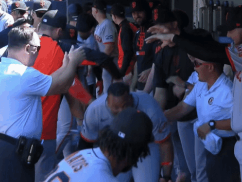 A Group Of Baseball Players Including One With The Number 13 On His Jersey GIF