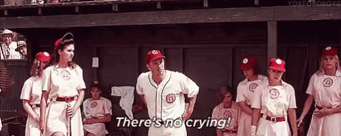 A Group Of Baseball Players Standing In A Dugout . GIF