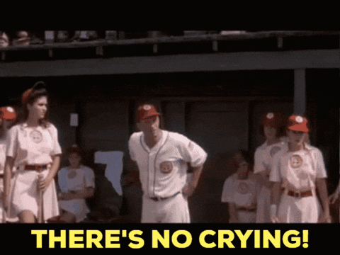 A Group Of Baseball Players Standing In A Dugout With The Words " There 'S No Crying " GIF