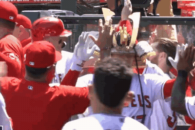 A Group Of Baseball Players Wearing Angels Jerseys GIF