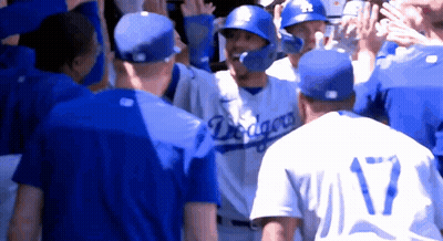 A Group Of Baseball Players Wearing Blue Jerseys With The Word Dragons On Them GIF
