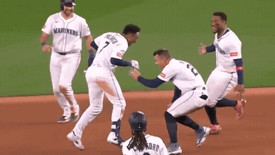 A Group Of Baseball Players Wearing Mariners Jerseys Are On The Field GIF