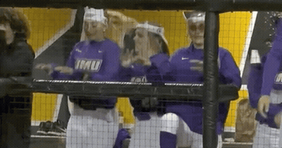 A Group Of Baseball Players Wearing Purple Shirts With Imu On Them GIF