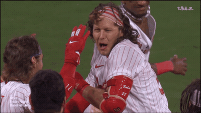 A Group Of Baseball Players With One Wearing A Jersey With The Number 28 On It GIF