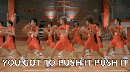 A Group Of Basketball Players Are Dancing On A Court While Holding Basketballs . GIF