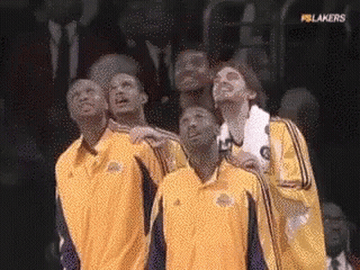 A Group Of Basketball Players Are Looking Up At The Sky GIF