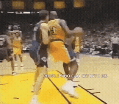 A Group Of Basketball Players Are Playing A Game Of Basketball And One Of Them Is Wearing A Number 13 Jersey . GIF