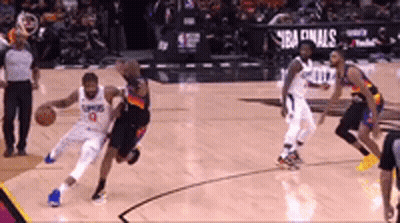 A Group Of Basketball Players Are Playing A Game Of Basketball . GIF